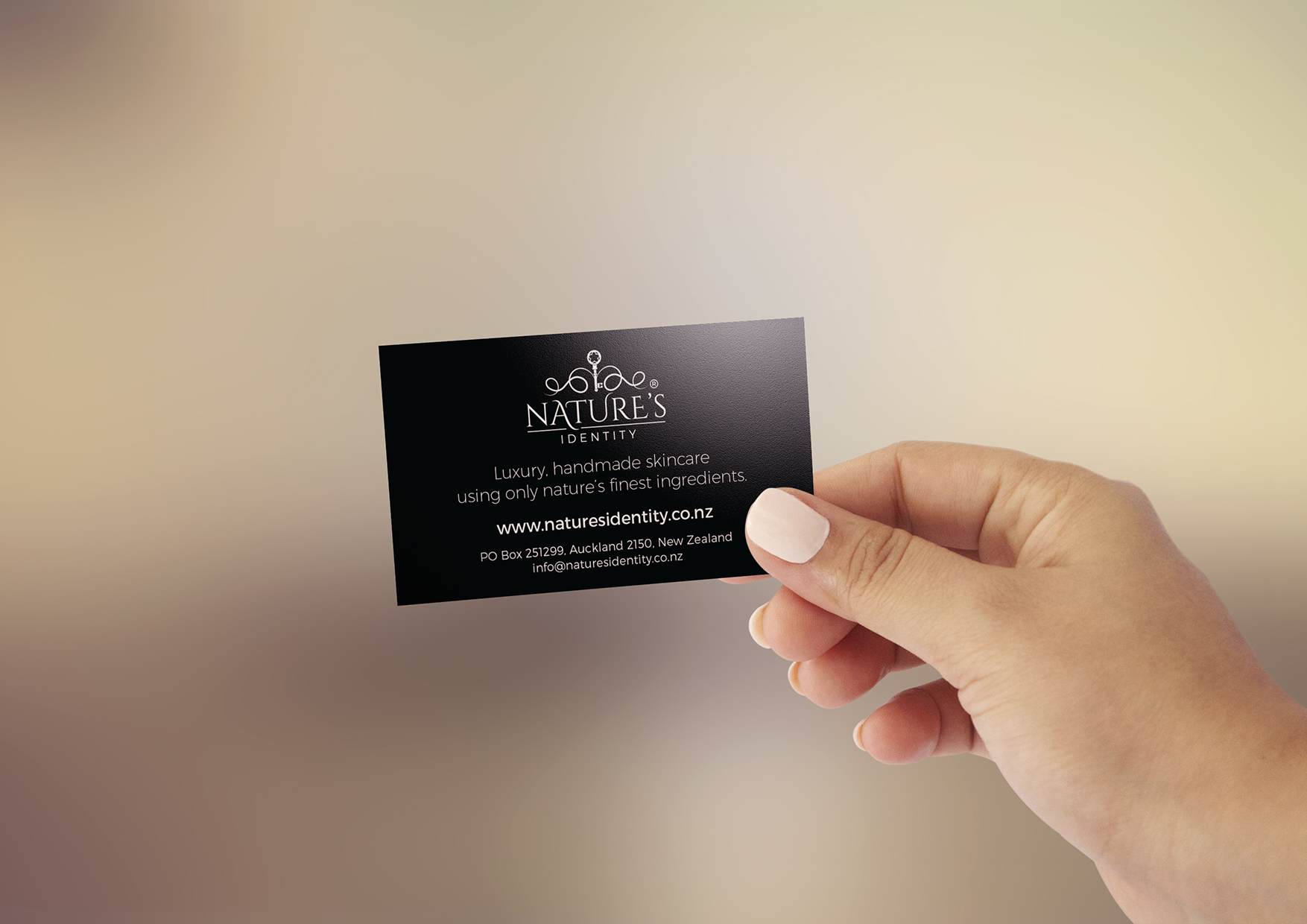 Beauty industry business card Beauty industry business card in manicured hand, black